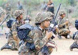 Women soldiers attend a weapon training session at an Army camp at Chengalpat
