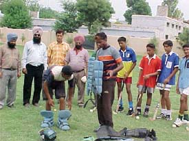 Kanwal Deep Singh, Indian hockey team goalkeeper, gives tips to players of Mahatma GandhiMemorial National Senior Secondary School, Mandi Ahmedgarh