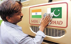Beneath the veneer: DTC employees giving final touches to the Delhi-Lahore bus, which is scheduled to leave on its first trial run on Friday