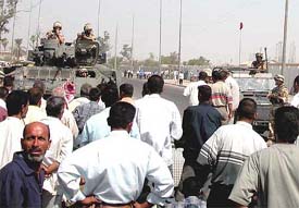 Port employees block British army vehicles during a protest