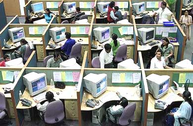 Employees work at a call centre in Bangalore