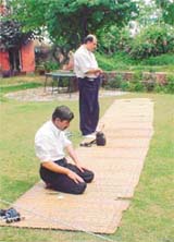 Two Pakistani travellers offer namaz during the Lahore-Delhi bus halt for lunch at Sirhind