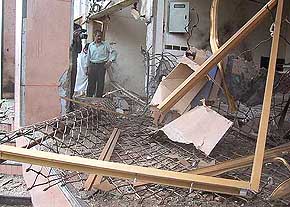 Officials inspect the site of the explosion in Karachi