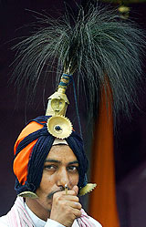 An Amarnath-bound Jangam in a traditional head gear adorned with peacock feathers