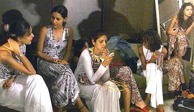 Indian models take a break during rehearsal for India Fashion Week in Mumbai on Sunday. 