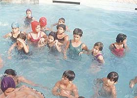Children participating in a swimming competition organised by Brooklyn School
