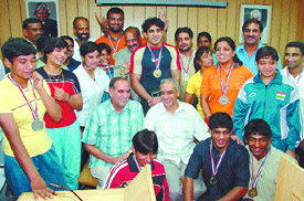The Indian wrestling squad with Union Minister Vikram Verma