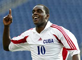 Lester More of Cuba celebrates his first goal against Canada