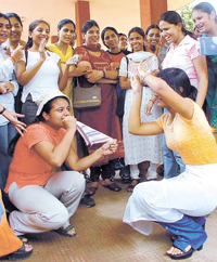 Students being put through light-hearted fun on the first day of the new academic session at Delhi University on Wednesday.