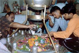 Devotees offer milk, Ganga water and ‘bel’ leaves to Lord Shiva at the ancient Sanglan Wala Shivala