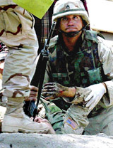 A US soldier tries to save a wounded colleague
