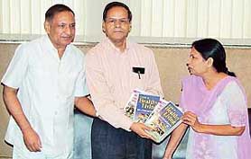 The Vice-Chancellor of Panjab University, Prof K.N. Pathak, releases a set of two books -- 'Healthy Living' and Better Health after 50 -- written by Dr Meenal and Dr R. Kumar at the Vice-Chancellors office in Chandigarh on Friday