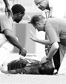 Marc Vivien Foe of Cameroon lies on the field 