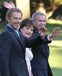 British Prime Minister Tony Blair, his wife Cherie Blair and US President Bush wave as they walk to Marine One 