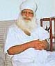 Baba Iqbal Singh, head of the complex