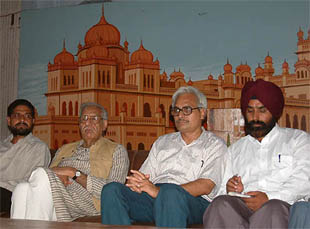 Mr Kuldip Nayar, veteran journalist and Rajya Sabha member (second from left), with Mr Satnam Manek to chalk out the joint Indo-Pak programme 
