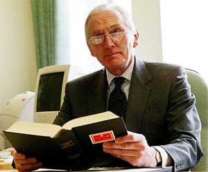 Britain's Lord Hutton holds a news conference