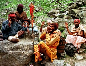 Amarnath-bound sadhus take a break near the heights of Pissu top
