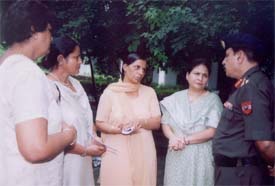 Brig Sunil Dhawan, Station Commander, Ludhiana, talks to Ms Nirmala Devi