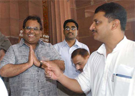 Actor-turned-director and Rajya Sabha Member Satish Kaushik being welcomed by Union Civil Aviation Minister