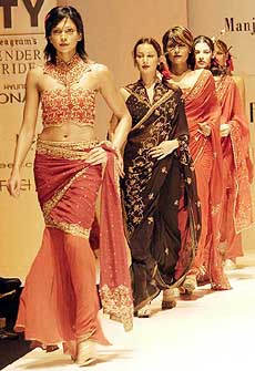 Models display Manju and Bobby Grover's collections at the Lakme India Fashion Week 