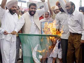 Anti Terrorist Front of India activists burn a Pakistani national flag to protest the Tanda Army camp attack