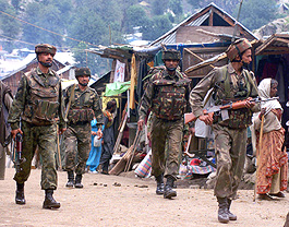 Soldiers patrol the streets of Chandanwari 
