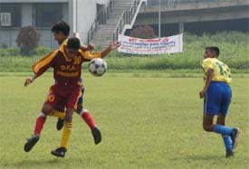 Nawanshahr and Jalandhar lads try to hold the ball during a match