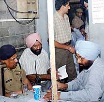 A police officer looks after the works of Punjab State Vigilance Department and Punjab Police officers