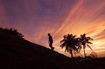 A man walks near the Malecon of Managua