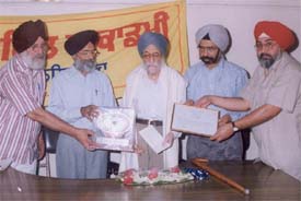 Dr Surinder Singh Narula being honoured at a function at Punjabi Bhavan