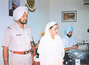 Jasbir Kaur, who had demanded Rs 7 lakh from a fellow villager, at the SSP office