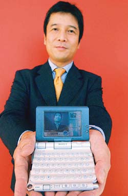 Masanobu Yoshida, president of the Sony Handheld Computer Company, holds the new Cli