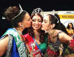 Subrina Dhammi, a student of Syracuse University, is wished by first runner-up Anjali Bhardwas (right) and second runner-up Diva Ranade after she was declared Miss India New York 2003 at a beauty pageant in Queens on Saturday.