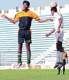 An aerial duel for the ball in the match between Garhwal Heroes and Royal Club in the Delhi Soccer Association