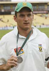 South Africas cricket captain Graeme Smith shows his player of the match medal