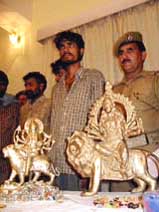 The police show some of the recovered idols after they nabbed a gang of thieves in Jammu 