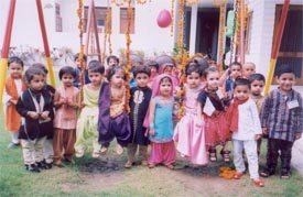 Kids celebrate the arrival of Sawan at Small Wonders Nursery School