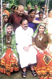 BJP President M. Venkaiah Naidu with folk dancers during the Teej festival in the Capital on Wednesday