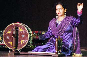 A student weaves with an 'Ambar Charkha' at the inauguration of the Design and Technology Complex