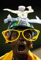 A fan of South Africa's Kaiser Chiefs watches in dismay as their team crashes against Tottenham Hotspur