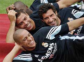 Real Madrids Ronaldo, Luis Figo and Roberto Carlos share a light moment
