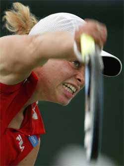 Second seed Kim Clijsters of Belgium serves to opponent Virginia Ruano-Pascual of Spain 