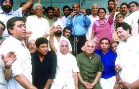 Delhi BJP chief Madan Lal Khurana along with party activists sitting on a dharna against the policies of the Congress-led Delhi Government at Moti Nagar chowk