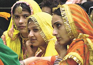 IN ALL THEIR TRADITIONAL GLORY: Dancing belles at a function to thank Prime Minister Atal Bihari Vajpayee for lowering the interest rates on crop loans at Talkatora Stadium in the Capital on Saturday.