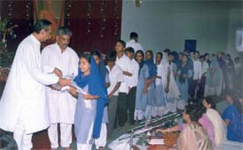 Uniforms being distributed to schoolchildren at Ram Sharnam Ashram, Kitchlu Nagar, Ludhiana, on Sunday