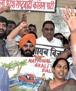 Third Front leaders protesting against poor upkeep of roads and flyovers in the Capital