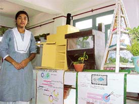 Rashmi Pandey with her prize-winning model on transgenic crops displayed at BCM Arya Model Senior Secondary School