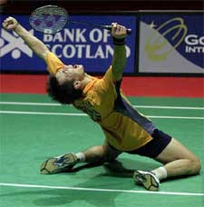 Chinas Xia Xuanze celebrates after winning the mens singles final at the World Badminton Championships 