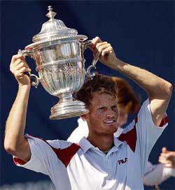 Wayne Ferreira of South Africa holds up the Mercedes-Benz Perpetual trophy after defeating Australia's Lleyton Hewitt